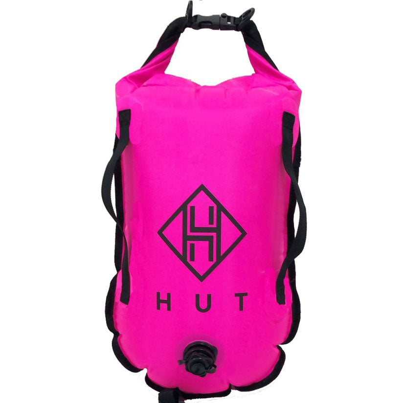 Pink dry bag with black straps and logo on a white background
