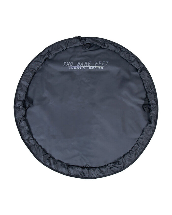 Black round changing mat on a white background