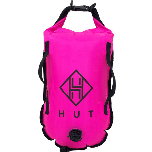 Pink dry bag with black straps and logo on a white background