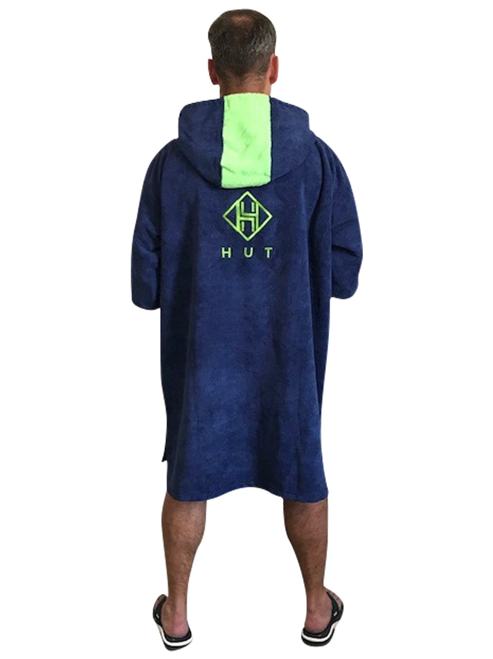 Person wearing a blue and green robe with a logo on the back, on a white background