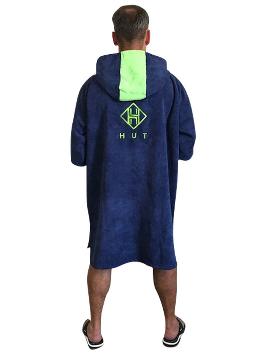 Person wearing a blue and green robe with a logo on the back, on a white background